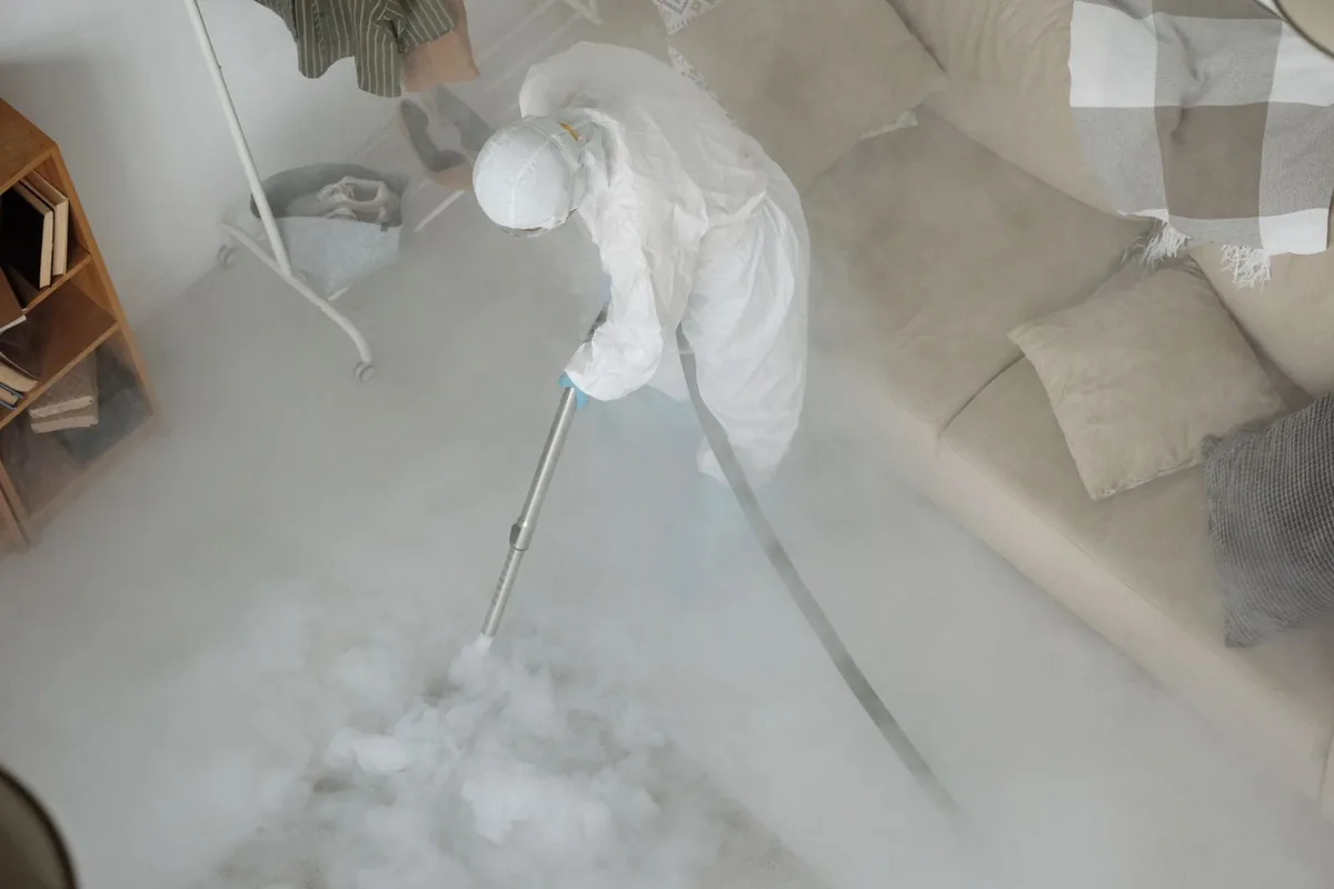 Biohazard cleanup technician in protective equipment, Indianola, MS